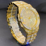 Klocka Stefan (herrklocka i guldfärg med romerska siffror & strassdetaljer)