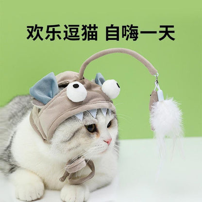 Kissanlelu höyhenillä ja pääkappaleella – Itseaktivoituva leikki