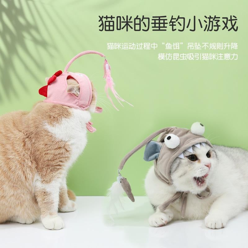 Kissanlelu höyhenillä ja pääkappaleella – Itseaktivoituva leikki