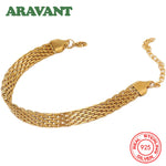 Armband Nora (armbandskedja i klockrem-design – silver & guldfärg)