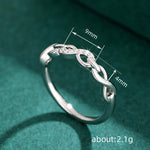 Ring Ella (infinityring med gnistrande zirkoner – evighetsdesign)