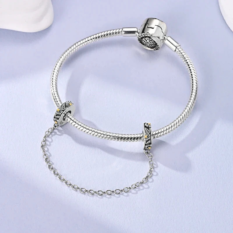 Berlocker Saga (säkerhetskedja & berlocker – flygplan, blomma & kamera)