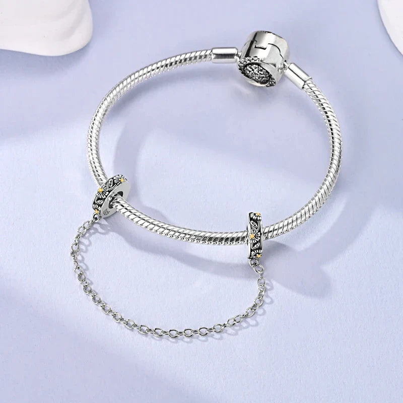 Berlocker Saga (säkerhetskedja & berlocker – flygplan, blomma & kamera)