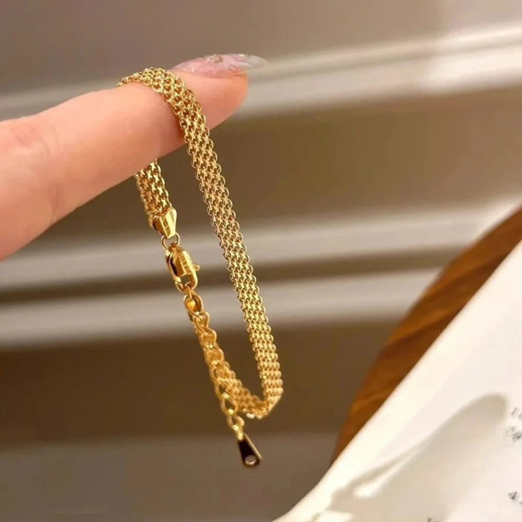 Armband Nora (armbandskedja i klockrem-design – silver & guldfärg)