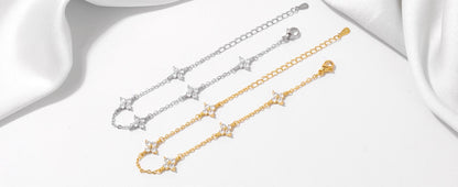 Armband Linn (fyrklöver-armband i guldfärg med zirkoner)