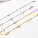 Armband Linn (fyrklöver-armband i guldfärg med zirkoner)