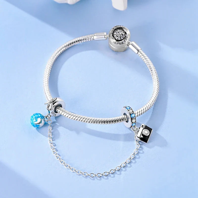 Berlocker Saga (säkerhetskedja & berlocker – flygplan, blomma & kamera)