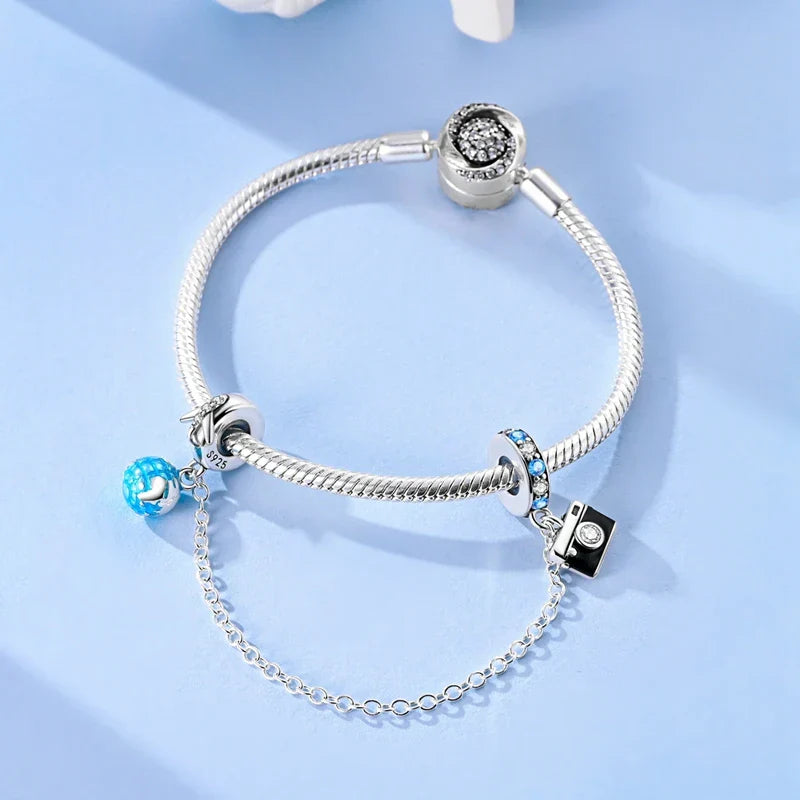 Berlocker Saga (säkerhetskedja & berlocker – flygplan, blomma & kamera)