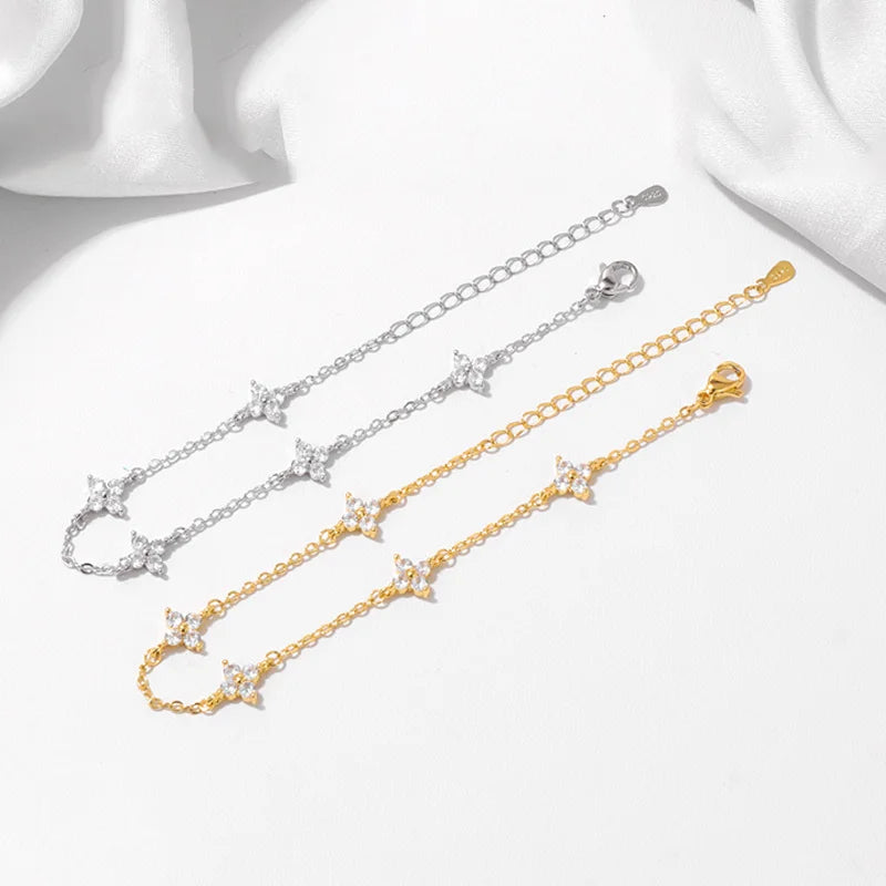 Armband Linn (fyrklöver-armband i guldfärg med zirkoner)