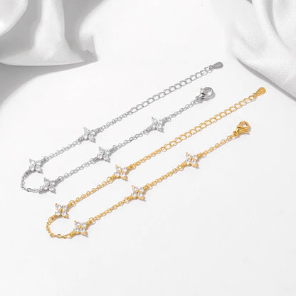 Armband Linn (fyrklöver-armband i guldfärg med zirkoner)
