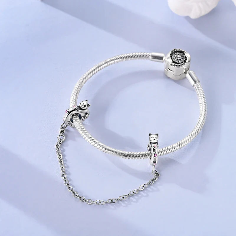 Berlocker Saga (säkerhetskedja & berlocker – flygplan, blomma & kamera)