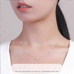 Armband Linn (fyrklöver-armband i guldfärg med zirkoner)