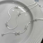 Armband Elise (enkelt armband med rosett & geometrisk design)