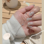 Armband Linn (fyrklöver-armband i guldfärg med zirkoner)