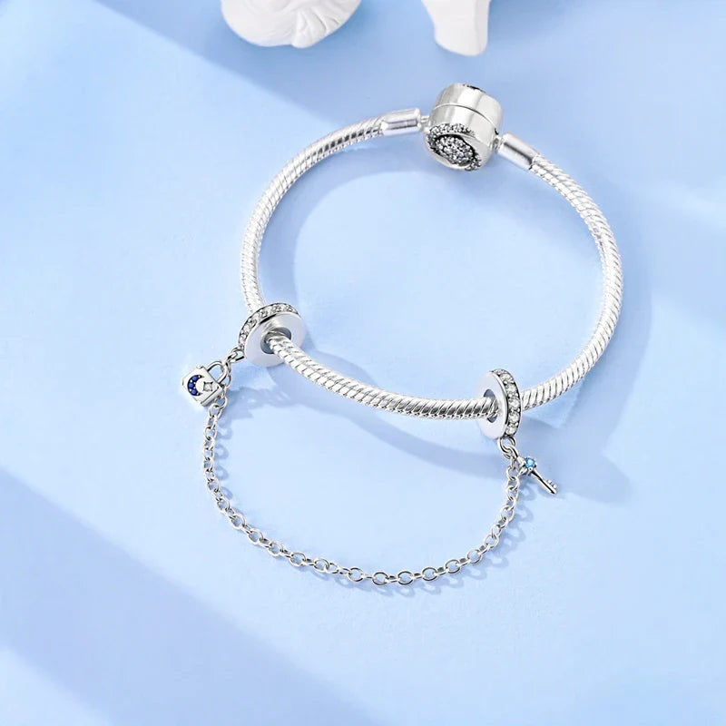 Berlocker Saga (säkerhetskedja & berlocker – flygplan, blomma & kamera)