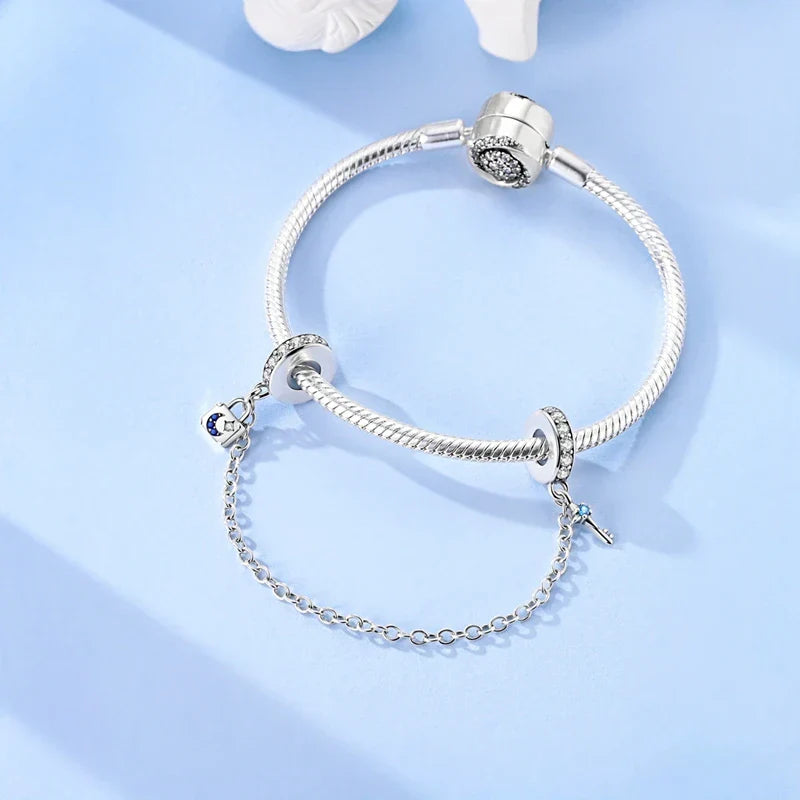 Berlocker Saga (säkerhetskedja & berlocker – flygplan, blomma & kamera)