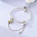 Berlocker Saga (säkerhetskedja & berlocker – flygplan, blomma & kamera)