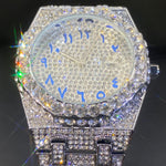 Magnus-kello (miesten kultainen kello, jossa on strassikiviä ja päivämääränäyttö)